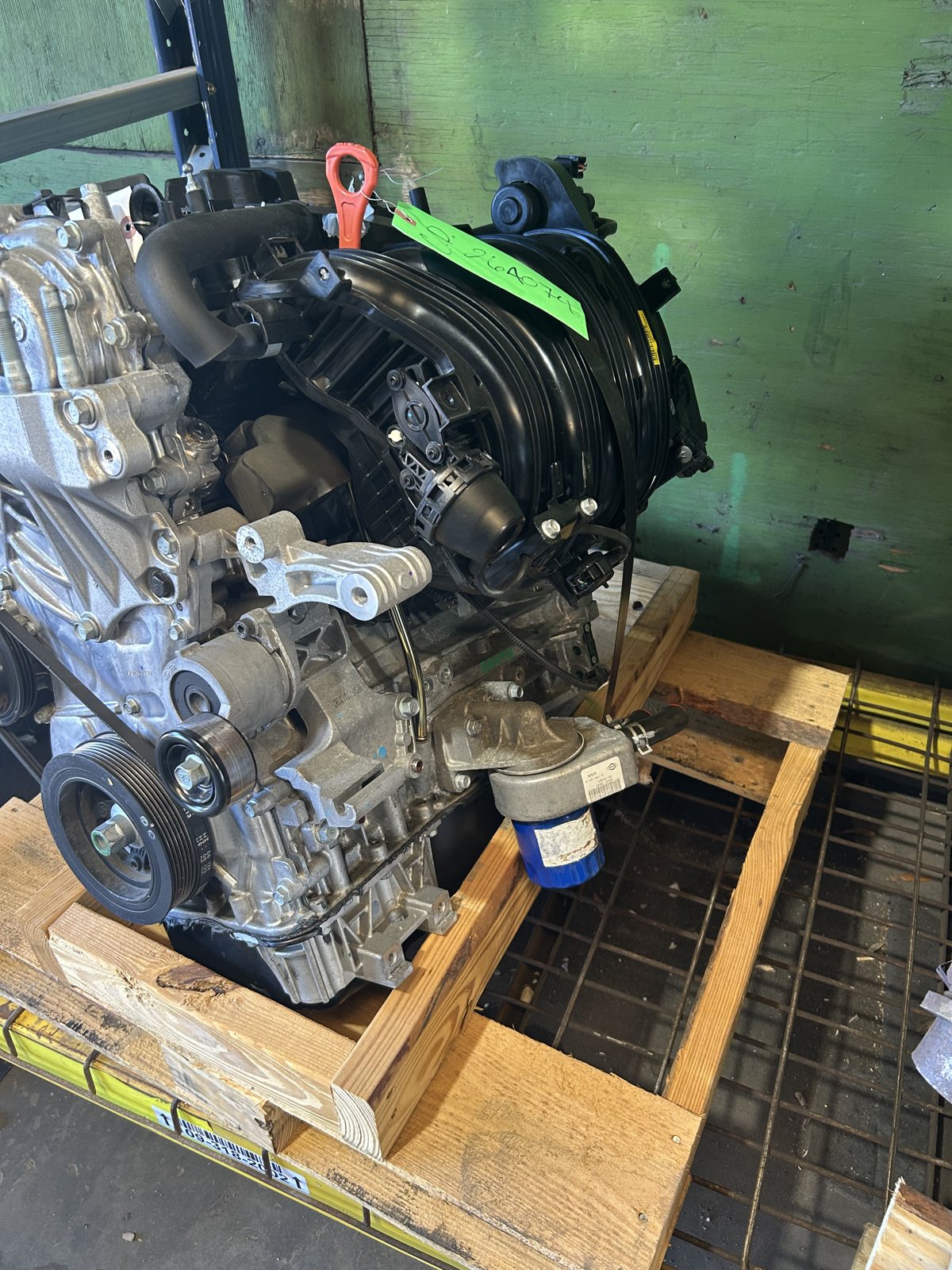 A complete engine assembly on a pallet, ready to install