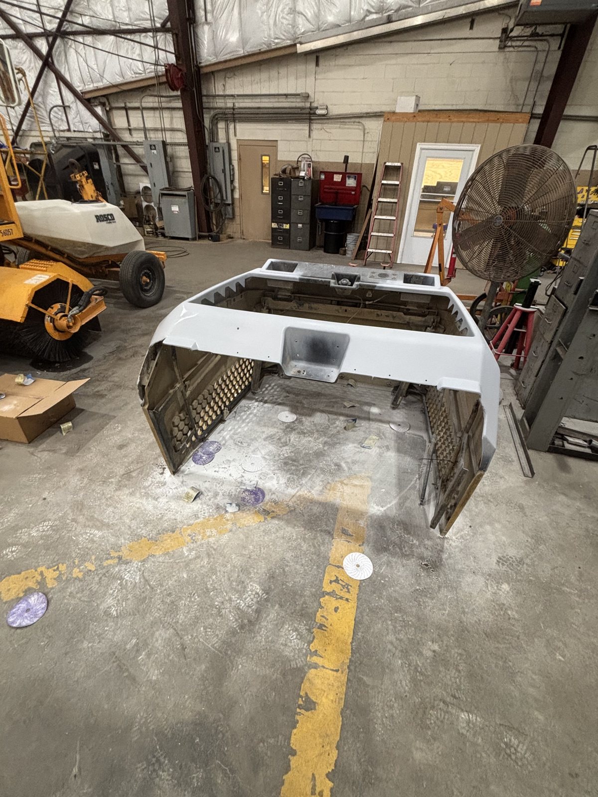 Refinished equipment hood panel, floor view