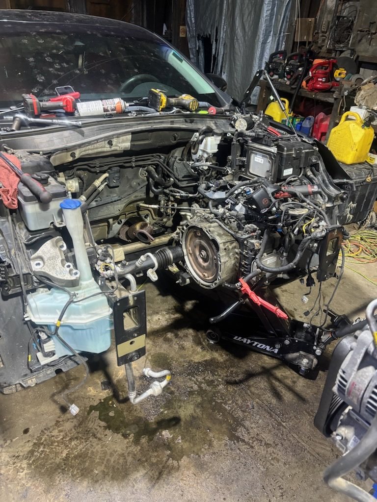 Engine bay from the side during removal.
