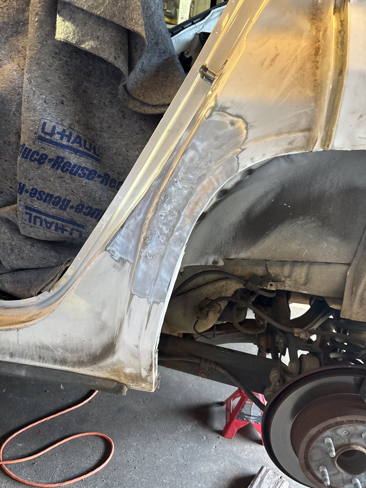 Wheel-arch panel repair, close-up.