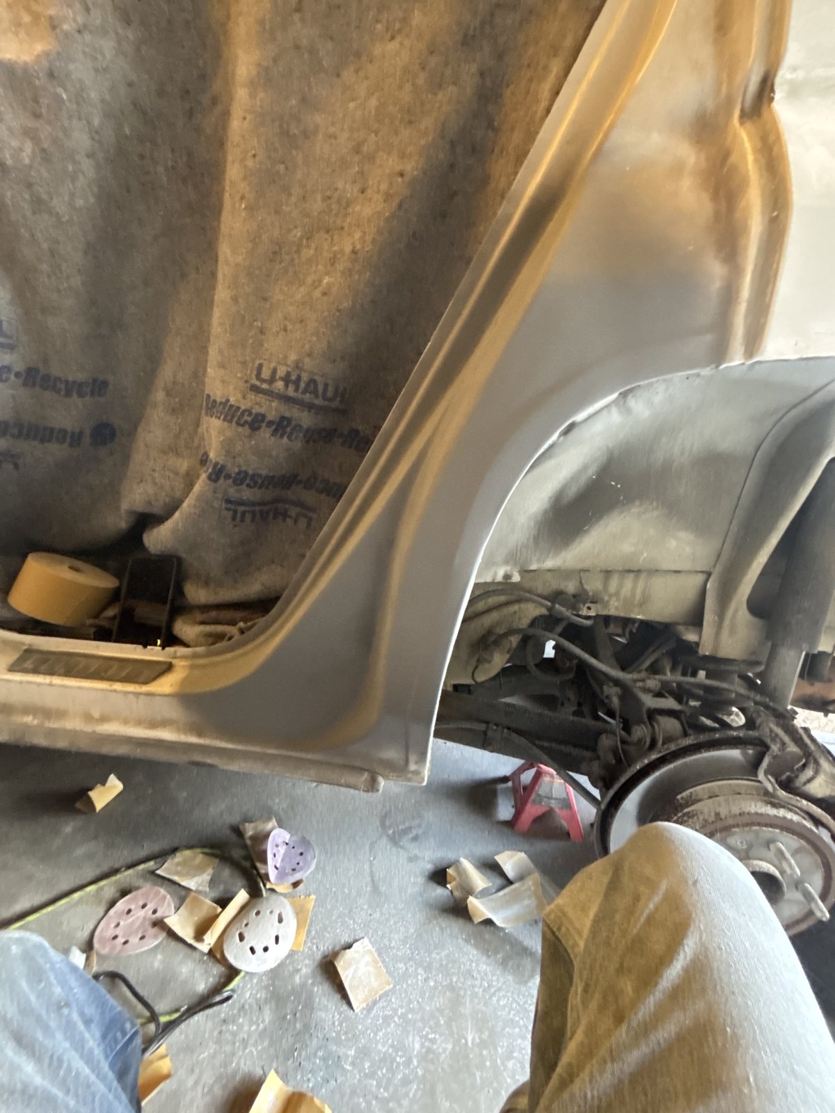 Panel prep with a brake rotor and tools visible